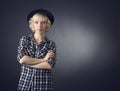 Beautiful young woman in a black hat