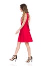 Walking Woman In High Heels And Red Dress. Side View. Royalty Free Stock Photo