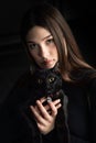 teenager in black sweater with black cat