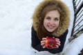 The beautiful young woman the blonde with blue eyes holds red apple in hand. Royalty Free Stock Photo
