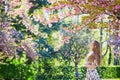 Beautiful young woman in blooming spring park Royalty Free Stock Photo