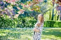 Beautiful young woman in blooming spring park Royalty Free Stock Photo