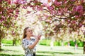 Beautiful young woman in blooming spring park Royalty Free Stock Photo