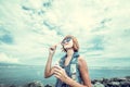 Beautiful young woman blowing bubble in outdoor, nature, near the ocean. Tropical magic island Bali, Indonesia. Royalty Free Stock Photo