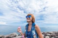 Beautiful young woman blowing bubble in outdoor, nature, near the ocean. Tropical magic island Bali, Indonesia. Royalty Free Stock Photo