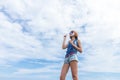 Beautiful young woman blowing bubble in outdoor, nature, near the ocean. Tropical magic island Bali, Indonesia. Royalty Free Stock Photo