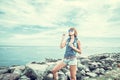 Beautiful young woman blowing bubble in outdoor, nature, near the ocean. Tropical magic island Bali, Indonesia. Royalty Free Stock Photo