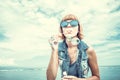 Beautiful young woman blowing bubble in outdoor, nature, near the ocean. Tropical magic island Bali, Indonesia. Royalty Free Stock Photo