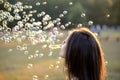 Beautiful Young Woman Blowing Bubbles Outside Royalty Free Stock Photo