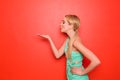 Beautiful young woman blowing kiss on color background Royalty Free Stock Photo