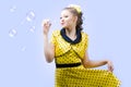 Beautiful young woman blowing soap bubbles Royalty Free Stock Photo
