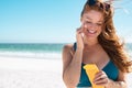 Woman with freckles applying sunscreen on face Royalty Free Stock Photo