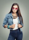 Beautiful young woman in blue denim and sunglasses Royalty Free Stock Photo