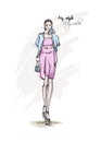 Beautiful young woman in a blue jacket and pink dress. Hand drawn fashion girl. Fashion model posing. Sketch. Royalty Free Stock Photo