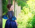 Beautiful young woman in blue medieval dress Royalty Free Stock Photo