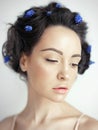 Beautiful young woman with blue muscari in her hair