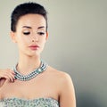 Beautiful Young Woman with Blue Pearls Royalty Free Stock Photo
