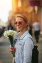 Beautiful and young woman with a bouquet of daffodils Royalty Free Stock Photo