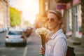 Beautiful and young woman with a bouquet of daffodils Royalty Free Stock Photo