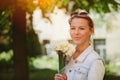 Beautiful and young woman with a bouquet of daffodils Royalty Free Stock Photo