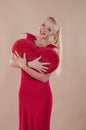 Beautiful young woman in a bright red slinky dress Royalty Free Stock Photo