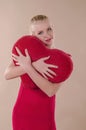 Beautiful young woman in a bright red slinky dress Royalty Free Stock Photo