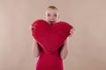 Beautiful young woman in a bright red slinky dress Royalty Free Stock Photo