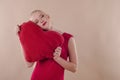 Beautiful young woman in a bright red slinky dress Royalty Free Stock Photo