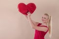 Beautiful young woman in a bright red slinky dress Royalty Free Stock Photo