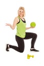 Beautiful young woman in bright sportswear with ball and dumbbells, isolated on white background Royalty Free Stock Photo