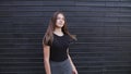 A beautiful young woman with brown hair smiling on a windy day slow motion Royalty Free Stock Photo