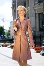 Beautiful Young Woman in brown raincoat