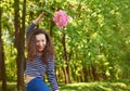 Beautiful young woman with a bunch of flowers. Royalty Free Stock Photo