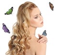 Beautiful young woman and butterflies on background Royalty Free Stock Photo