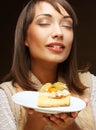 Beautiful young woman with a cake