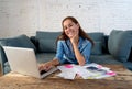 Beautiful young woman calculating and paying bills happy with business and home finances Royalty Free Stock Photo