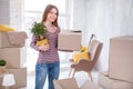 Beautiful young woman carrying belongings before moving out Royalty Free Stock Photo