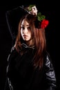 Beautiful young woman with chains and a red rose Royalty Free Stock Photo