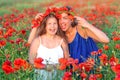 elegant young woman with child girl in poppy field, happy family having fun in nature, summer time Royalty Free Stock Photo