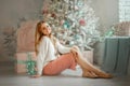 Beautiful young woman  at christmas eve Royalty Free Stock Photo