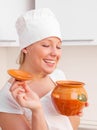 Beautiful young woman with a clay pot