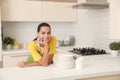 Beautiful young woman with clean dishes and cups Royalty Free Stock Photo
