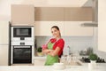 Beautiful young woman with clean dishes Royalty Free Stock Photo