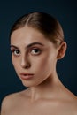 Beautiful young woman with clean perfect skin. Isolated girl in studio.  Portrait of beauty model with natural nude make up and lo Royalty Free Stock Photo