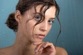 Beautiful young woman with clean perfect skin and water moisture drops touching face Royalty Free Stock Photo