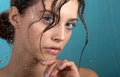 Beautiful young woman with clean perfect skin and water moisture drops touching face Royalty Free Stock Photo