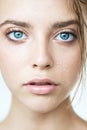 Beautiful young woman with clean perfect skin and water moisture drops touching face Royalty Free Stock Photo