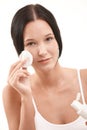 Beautiful young woman cleaning face Royalty Free Stock Photo