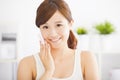 Beautiful young woman cleaning her face with cotton Royalty Free Stock Photo