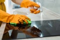 Beautiful woman cleaning her kitchen hood from dust Royalty Free Stock Photo